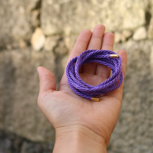 The Purple String & Gold Tips