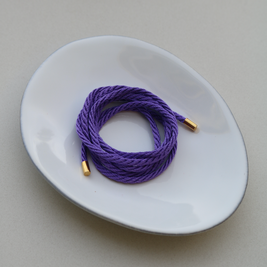 The Purple String & Gold Tips